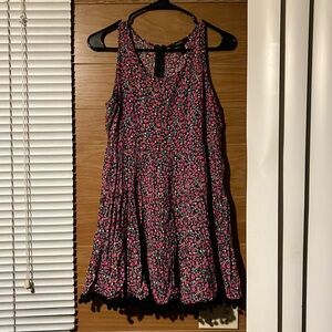 Floral dress with fuzz balls on the dress skirt